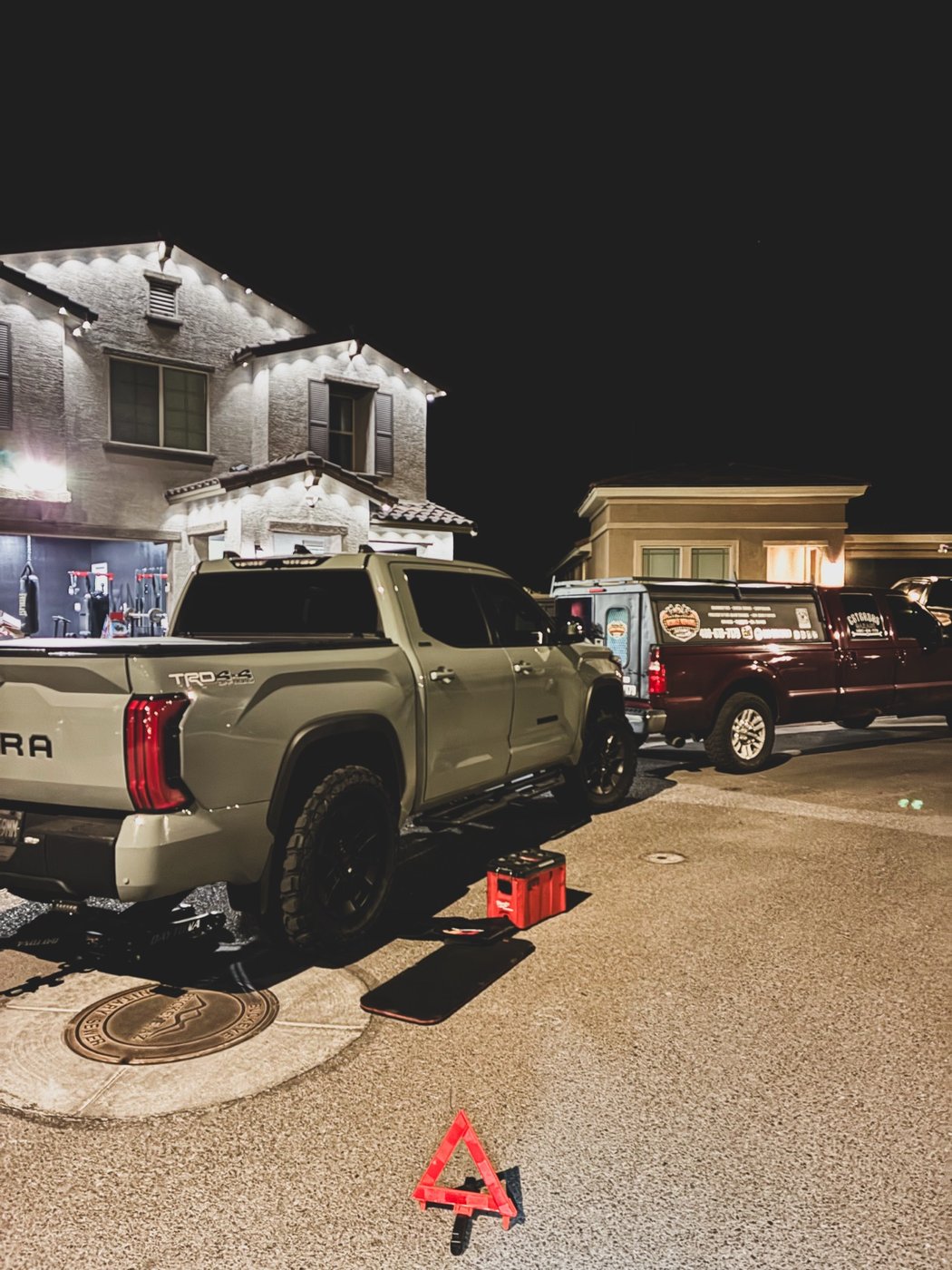 Night roadside repair with a Toyota Tundra and the Estradas Garage work truck